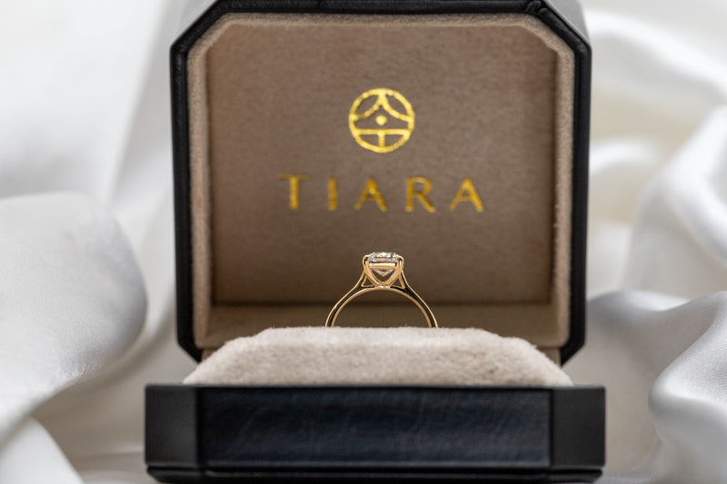 Hand raised showing ring